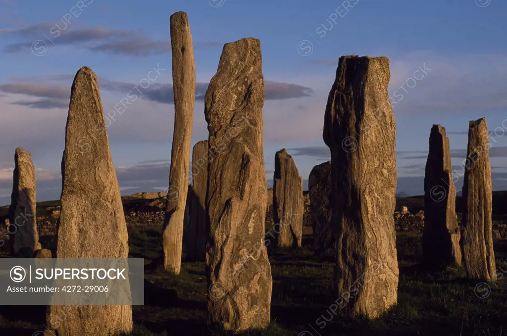 Sunset over the central circle of standing stones at Callanish.  An ancient stone circle dating back to Neolithic times, Callanish is the most dramatic prehistoric site in the Hebrides and is sometimes referred to as the Stonehenge of Scotland