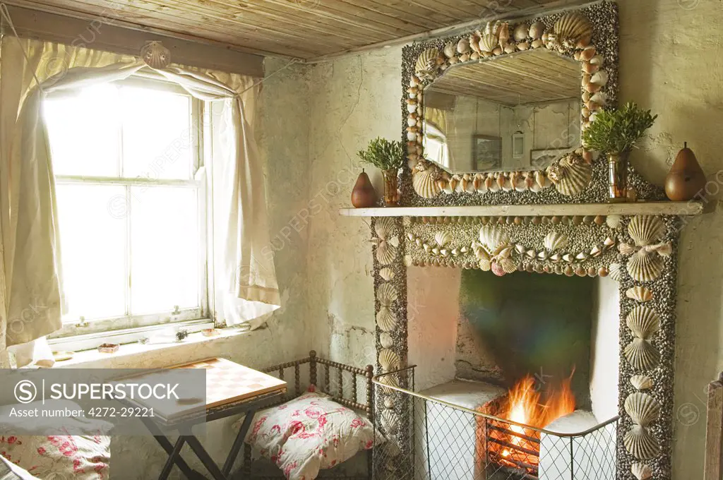 Shell encrusted fireplace in GlenBatrick Lodge.  The lodge overlooks the white sandy shore of Loch Tarbert on the west side of Jura.  Beautifully isolated the lodge is only accessible by boat or a five hour walk.