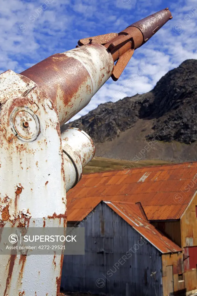 South Georgia and the South Sandwich Islands, South Georgia, Cumberland Bay, Grytviken. A Whaling boat's  harpoon towards the whaling processing buildings.