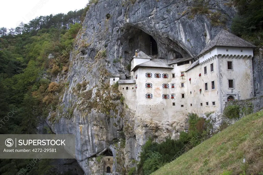Slovenia, Predjama Castle. A Renaissance castle built within a cave mouth in southwestern Slovenia, Predjama Castle is located near Postojna.