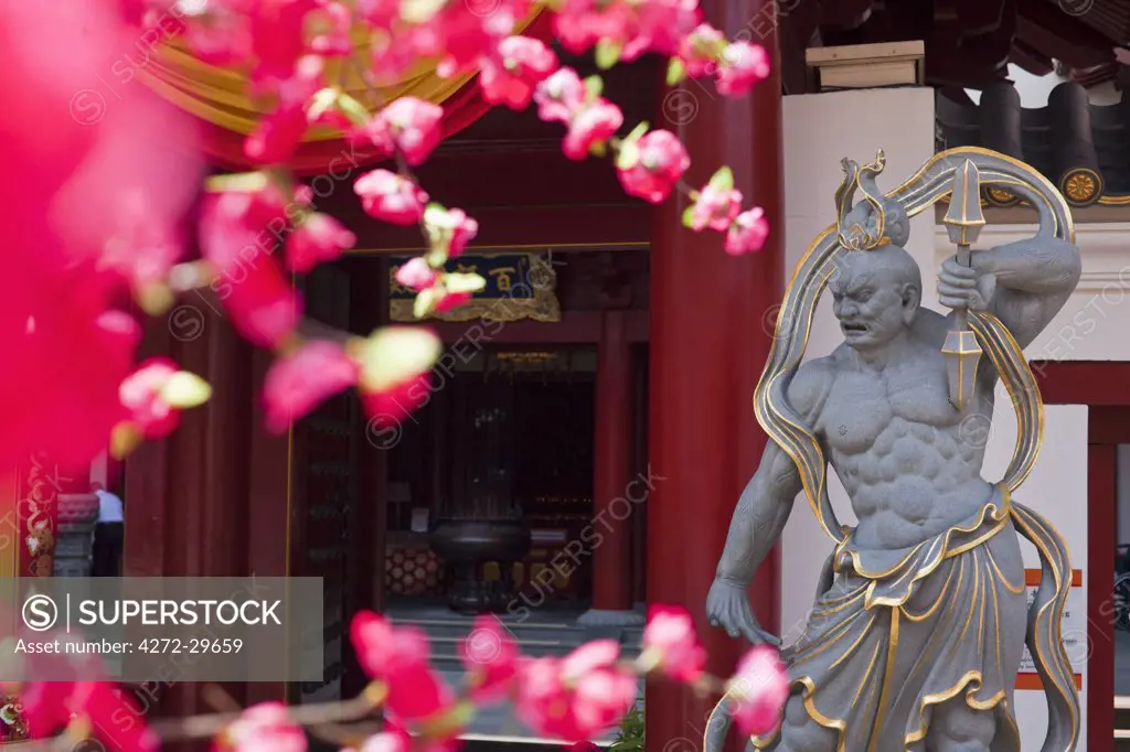 Singapore, Singapore, Chinatown.  Guardian statue at the Buddha Tooth Relic Temple and Museum.