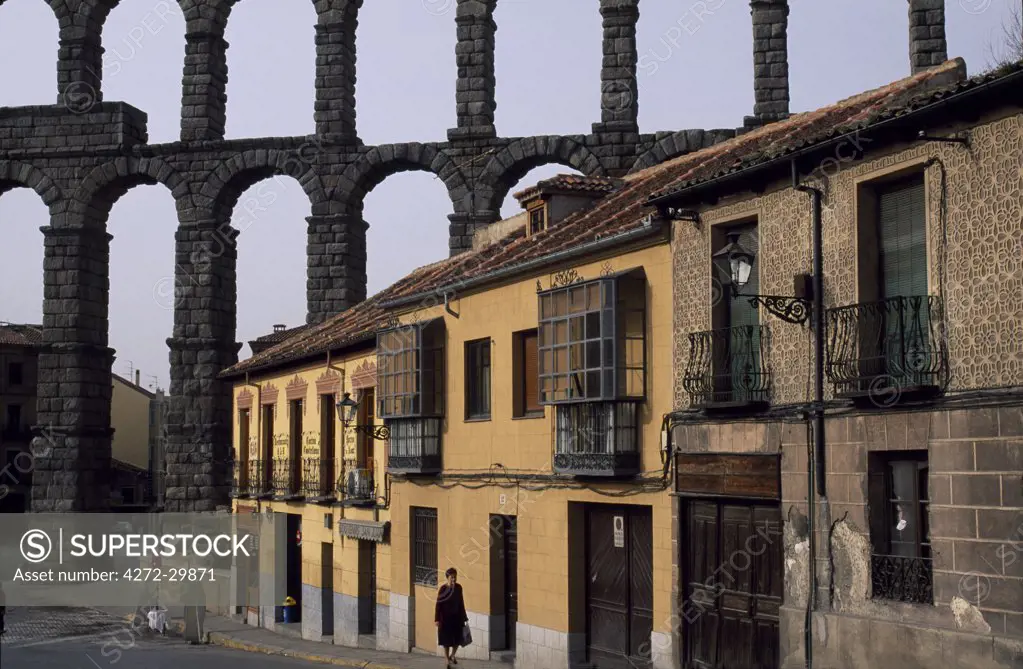 The famous 800 metre long Roman aqueduct looms over the houses of the city
