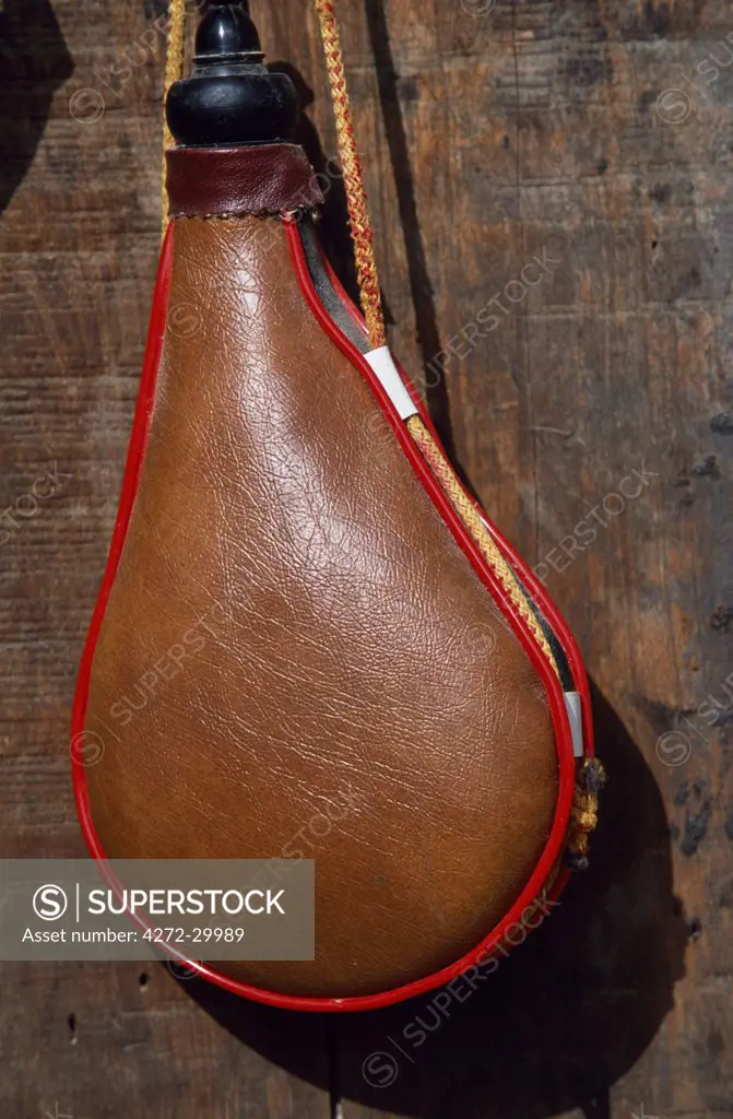 A leather wineskin hanging at a market stall in Quel