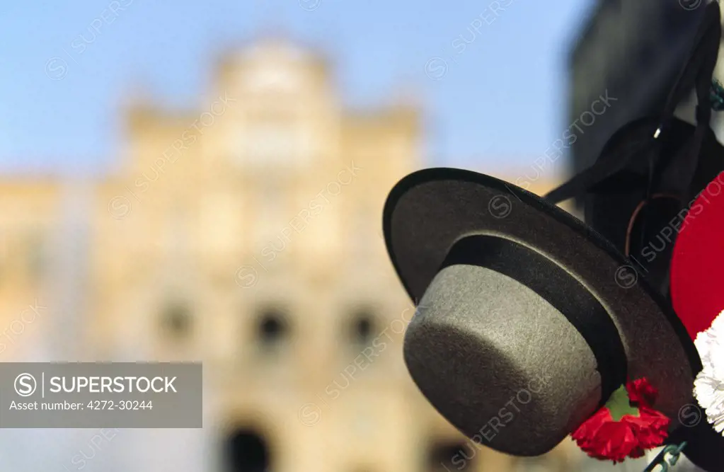 A Spanish gaucho hat hangs in front of the Plaza de Espana in Seville
