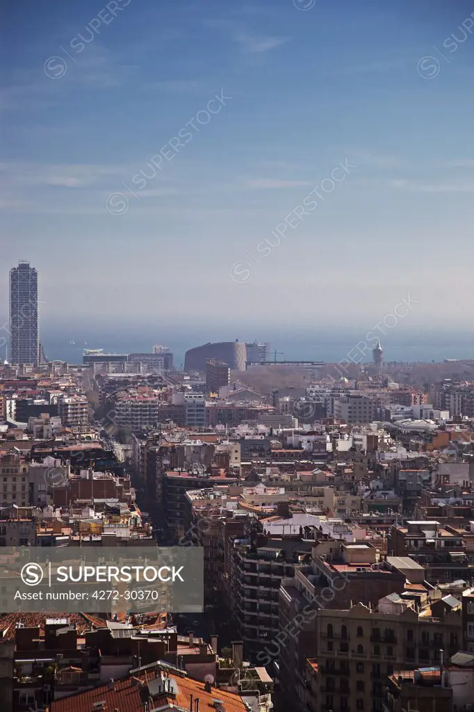 Spain, Cataluna, Barcelona, Sagrada Familia, view from the Sagrada Familia towers out over Barcelona looking towards the La Barceloneta district and the marina.  with the Hotel des Arts in the distance.