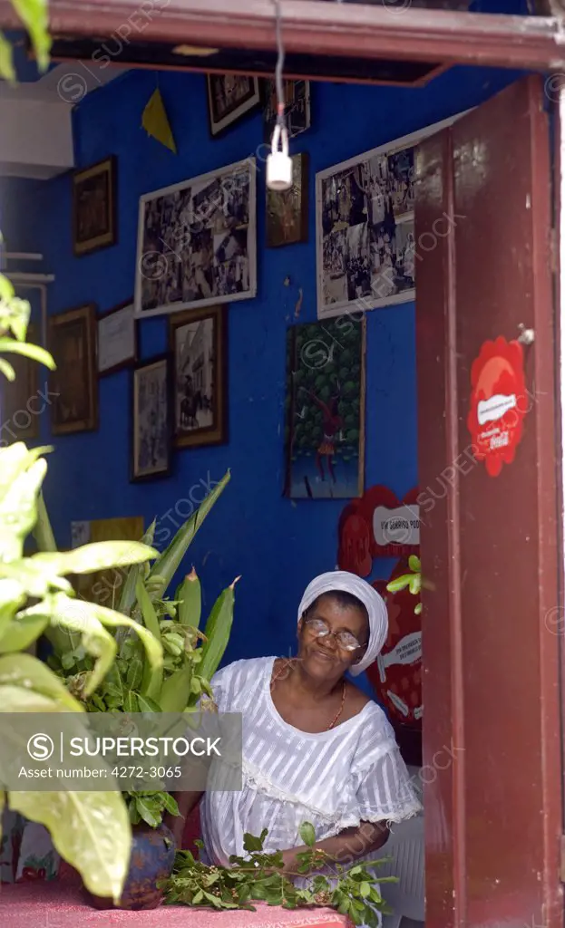 Cafe owner looks into the street in the UNESCO city of Salvador da Bahia, North East Brazil
