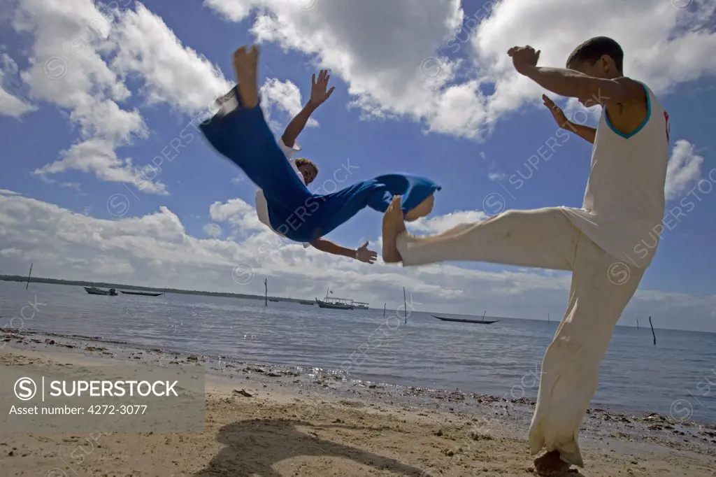 Capoeira, the Brazilian fight-dancing martial art, demonstrated on a Tinhare archipelago beach in the Bahia region of the north east of Brazil