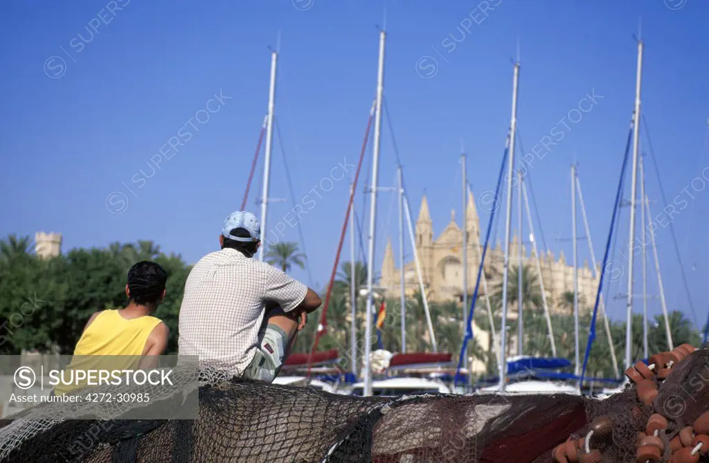 Fishermen in front of the Cathedral  La Seu, Palma de Mallorca, Balearic Islands, Spain