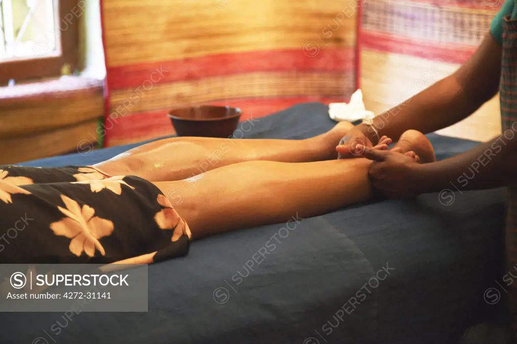Woman receiving Ayurvedic massage, Kandy, Sri Lanka (MR)