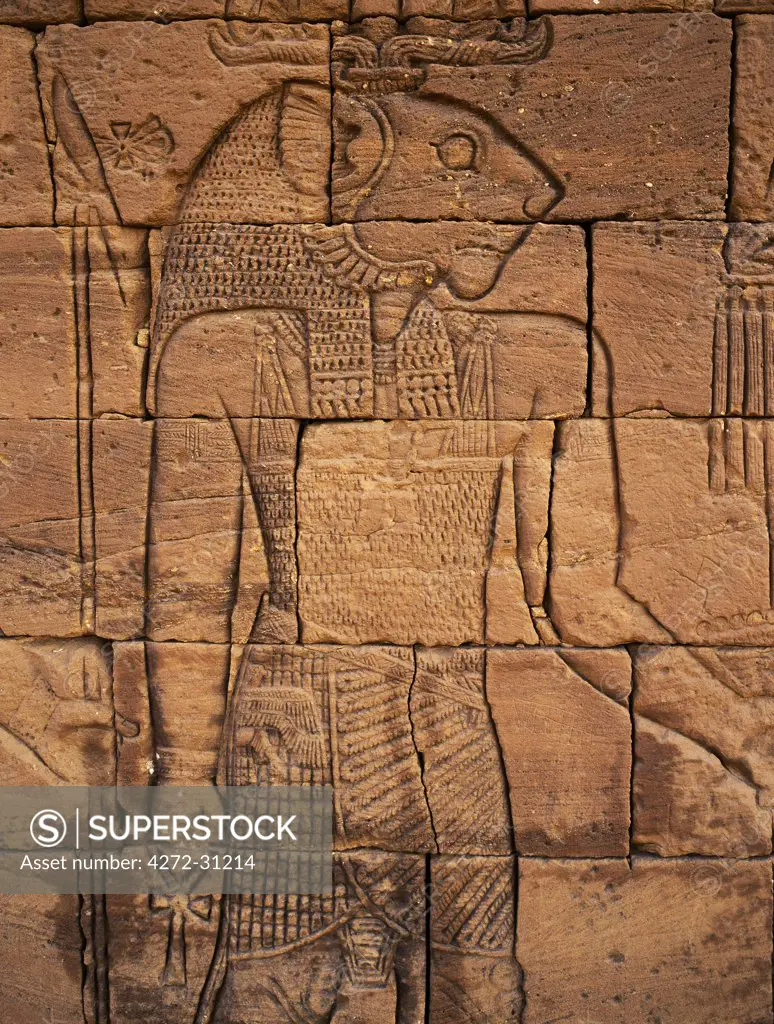 A carving of Apademak, the Lion God, on an exterior wall of the ruins of the Lion Temple situated beside an important wadi at Naga some 30 km from the Nile. This site of four ancient temples, discovered in 1821, has been dated between 1BC and 1AD.  The temples are fine examples of Afro-Egyptian architecture and are attributed to the Meroitic culture that flourished at that time.