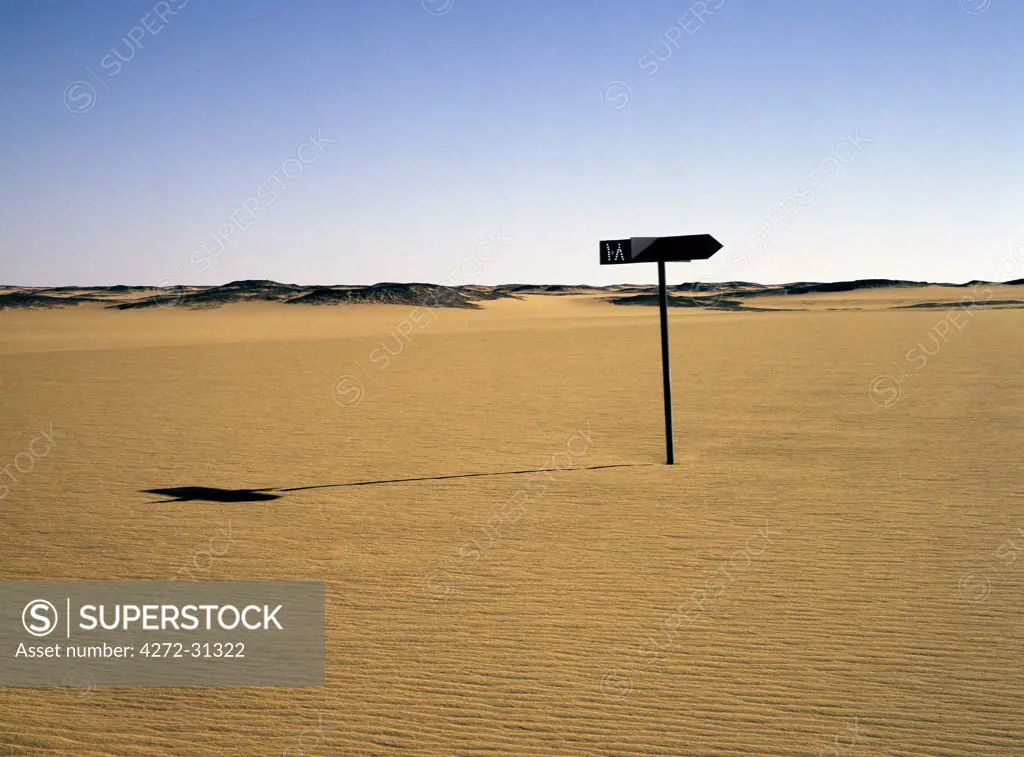 An old signpost marks a disused track across the Nubian Desert, north of Old Dongola.  It is marked in Arabic '108', which is probably the mileage from Karima to Dongola. The route across the desert now runs at least 10 km away from the sign.