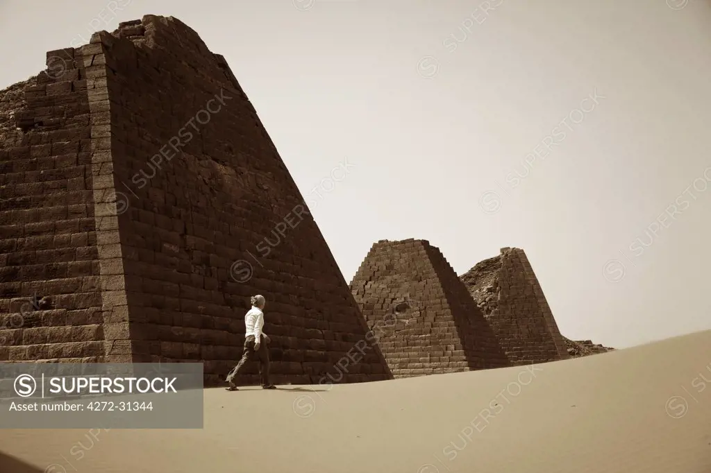Sudan, Begrawiya. A tourist explores the ancient Nubian Pyramids.