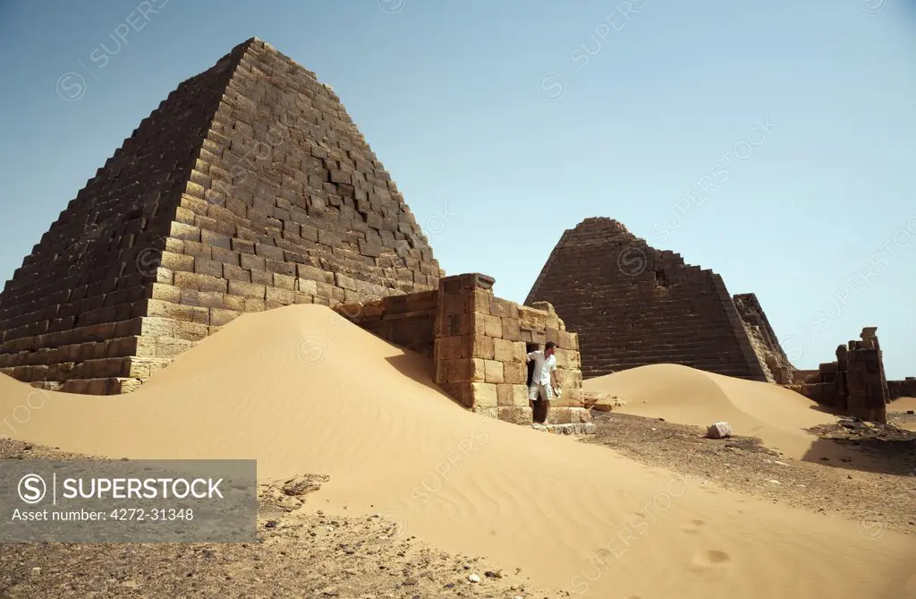 Sudan, Begrawiya. A tourist explores the ancient Nubian Pyramids.