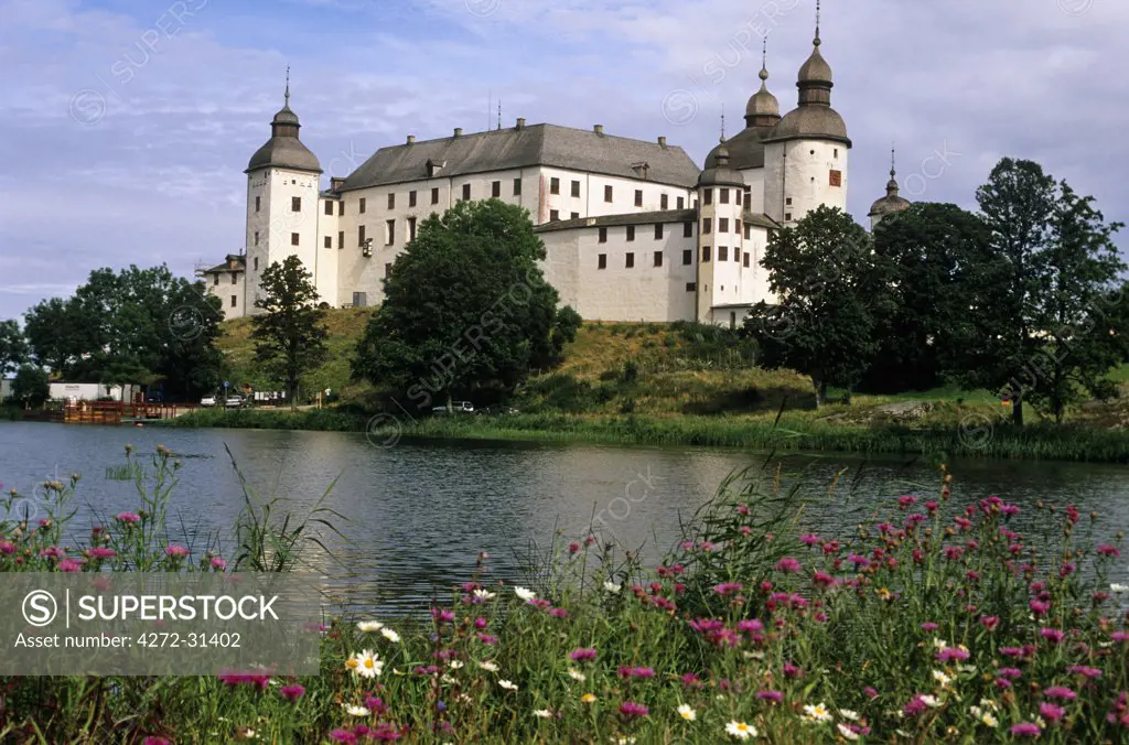 Sweden, Vastra Gotaland, Lake Vanern, Lacko Castle. The 13th-century Lacko Castle stands on the southern shores of Lake Vanern, Western Europe's largest lake.