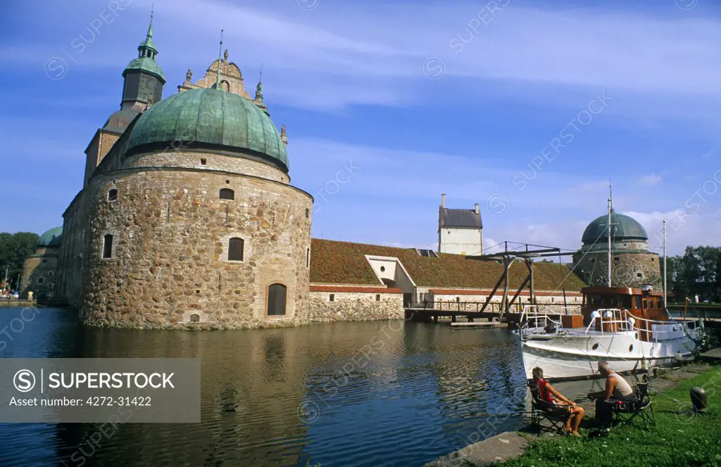 Sweden, Ostergotland, Vadstena. The 16th-century Vadstena Castle, or Slott, with its four muscular towers, is encircled by a broad moat.