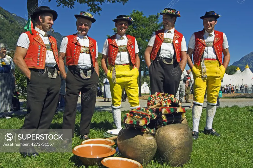 Cowbell ringers in Traditional Alpine Costume at the Unspunnen Bicentenary Festival, Interlaken, Jungfrau Region, Switzerland