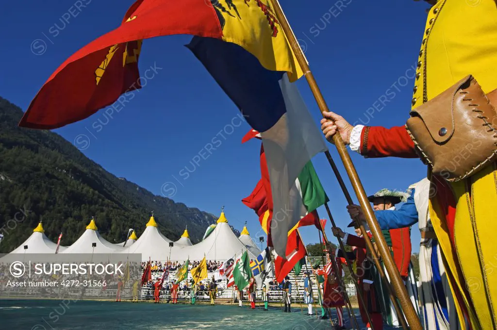 Regional flags of Switzerland are paraded at the Unspunnen Bicentenary Festival, Interlaken, Jungfrau Region, Switzerland