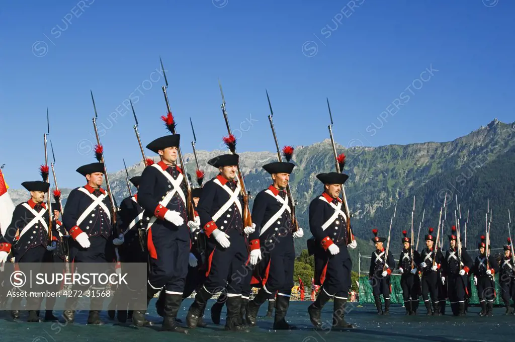 A military marching group parade in period costume at the Unspunnen Bicentenary Festival, Interlaken, Jungfrau Region, Switzerland