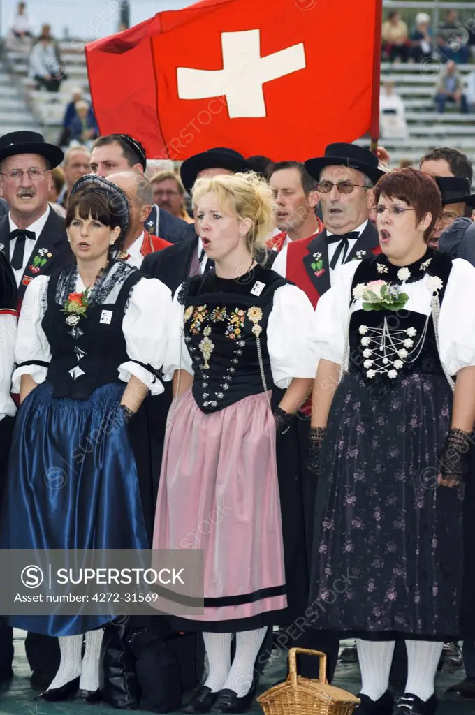 Choir singers in regional costume sing at the Unspunnen Bicentenary Festival, Interlaken, Jungfrau Region, Switzerland