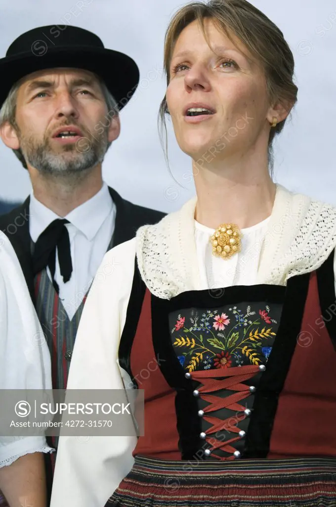 Choir singers in regional costume sing at the Unspunnen Bicentenary Festival, Interlaken, Jungfrau Region, Switzerland