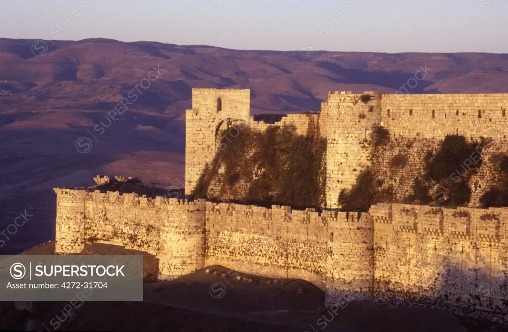 Sunset on the battlements of the Crusader castle of Krak de Chevalier C13th from the west