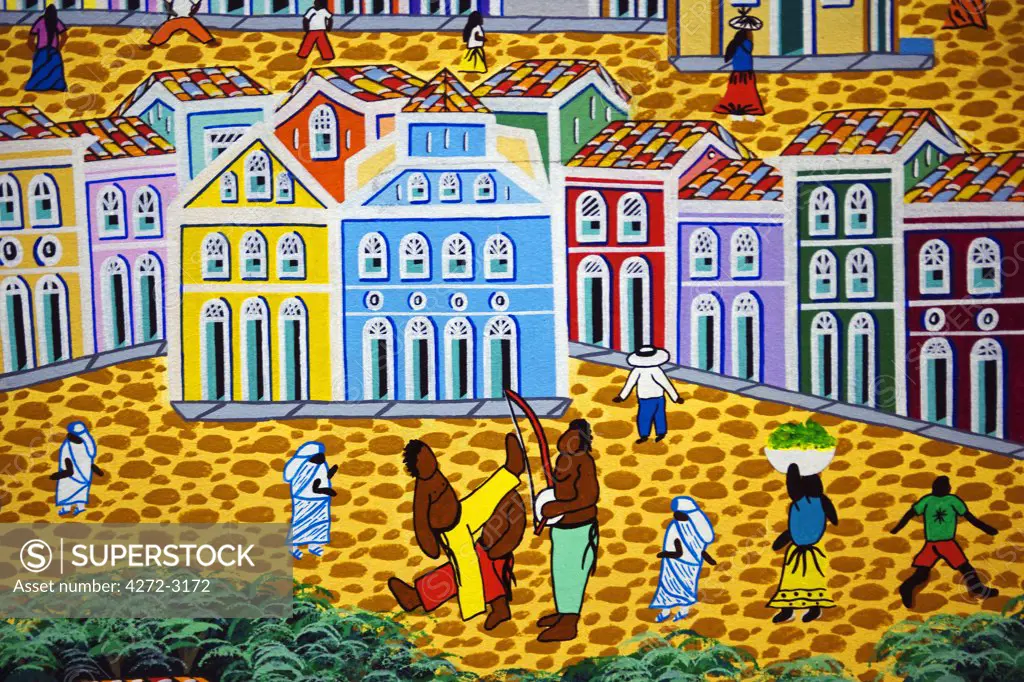 Brazil, Bahia, Salvador. The city of Salvador within the historic Old City, a UNESCO World Heritage listed location. Local art reflects the strong African influence with vibrant colours and traditional cultural scenes.