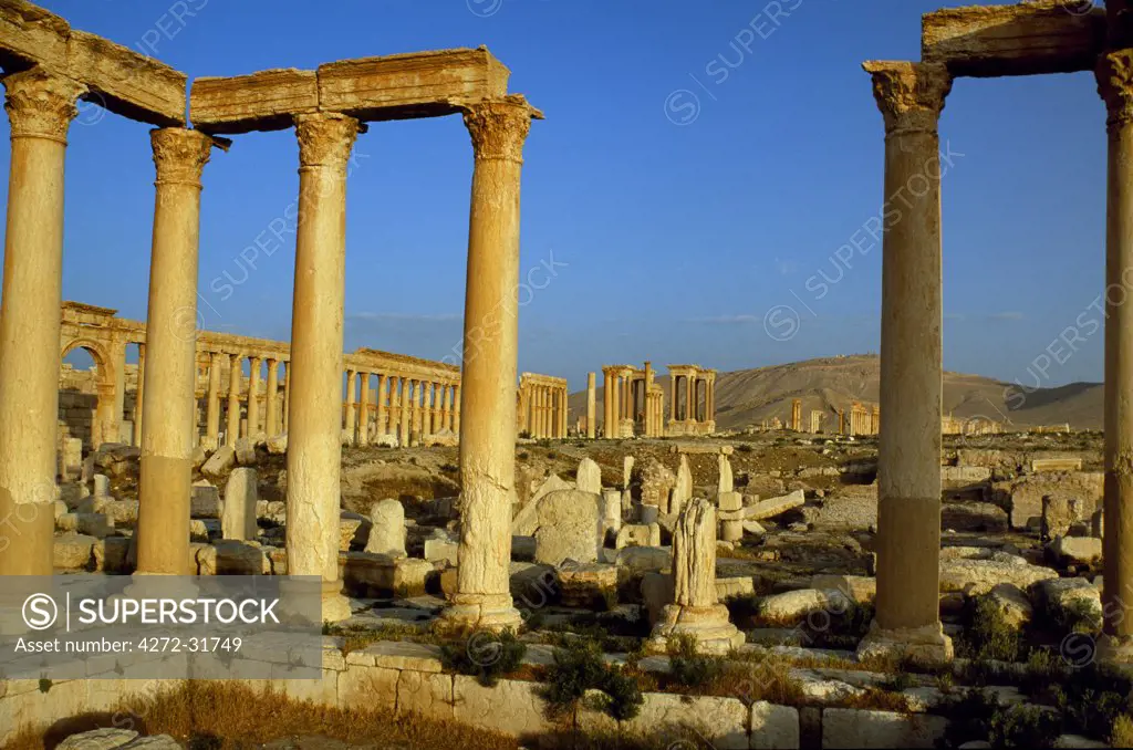 Pillars of the 'Great Colonnade' stretch into the distance at Palmyra aka Tadmor, a deserted city that despite Roman and Greek influences remained largely independent of Rome until its downfall in 273 AD.