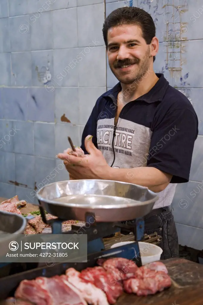 A butcher in the souq,  Aleppo, Syria