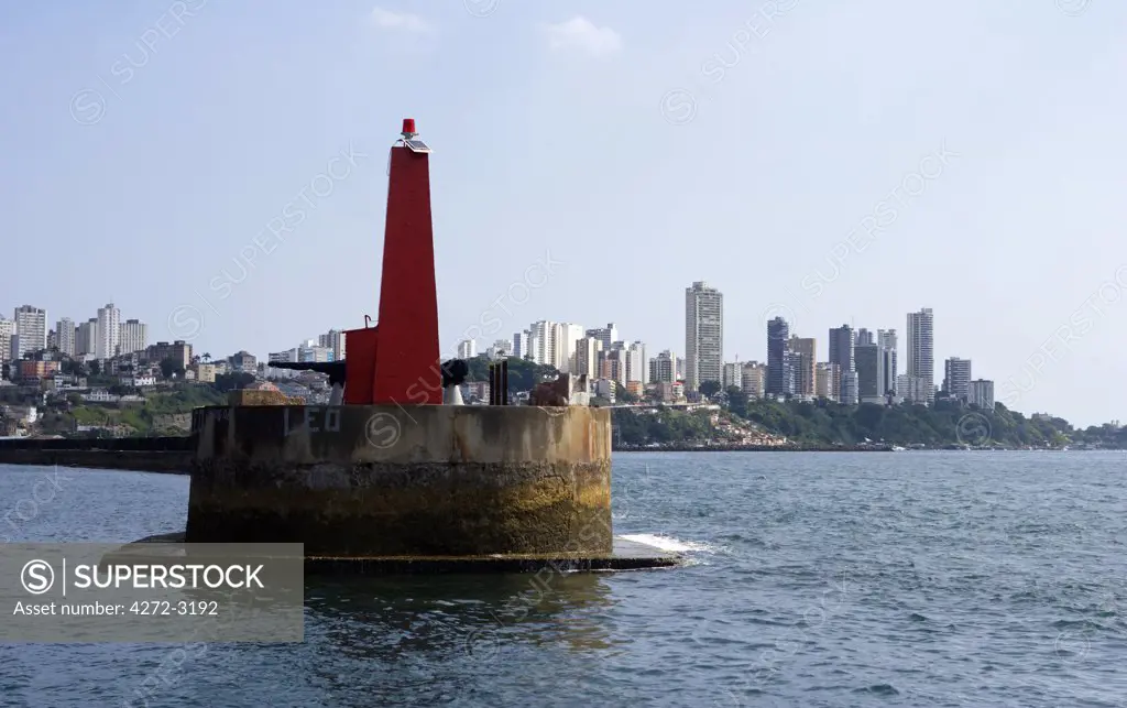 Brazil, Bahia, Salvador. Within the historic Old City, a UNESCO World Heritage site, a view from the sea of both the modern and the historic city.