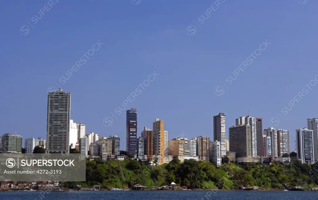 Brazil, Bahia, Salvador. Within the historic Old City, a UNESCO World Heritage site, view from the sea of both the modern and the historic city.