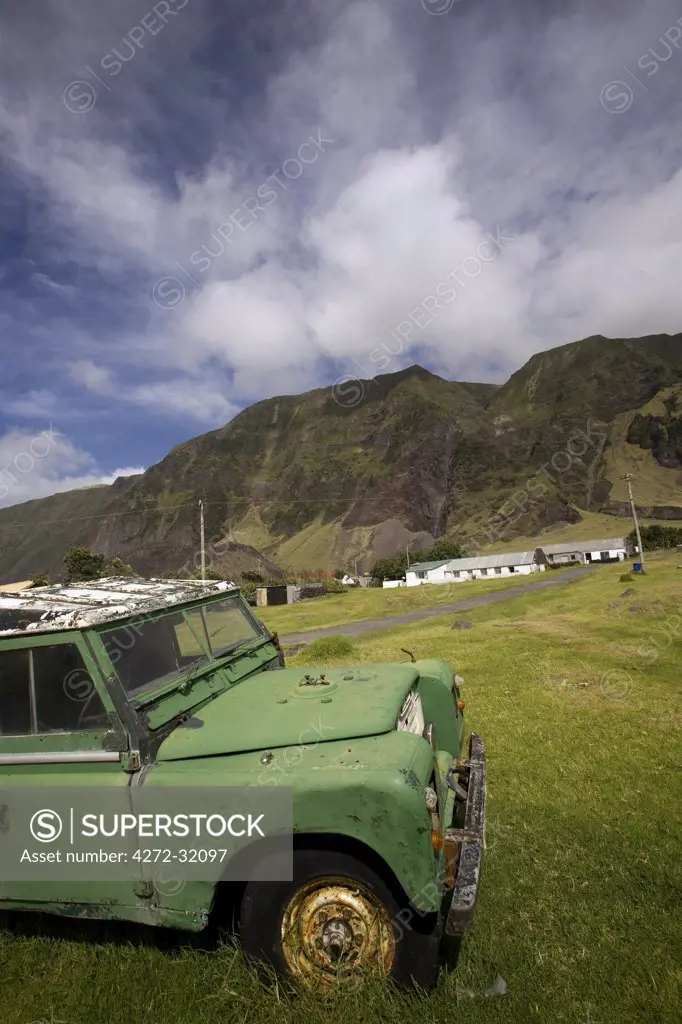 Tristan Da Cunha Island, settlement capital of Edinburgh.  Old landrover parked with the backdrop of the Queen Mary Volcano which dominated life on the island.