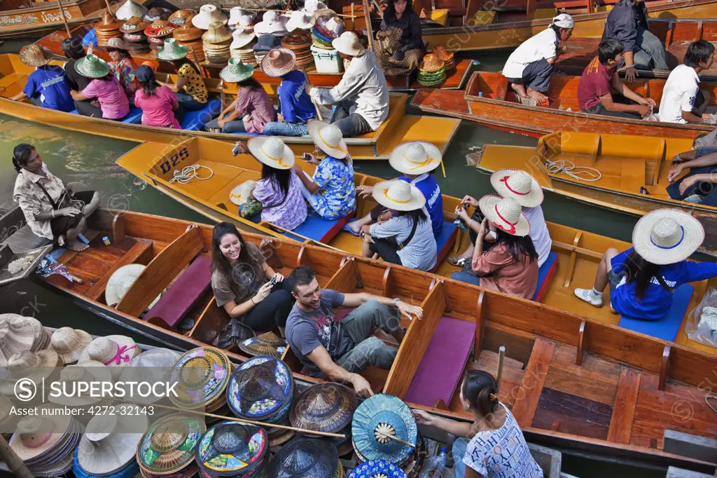 Thailand.The bustling floating market at Damnern Saduak, 80 km southwest of Bangkok, has been in existence since 1872.