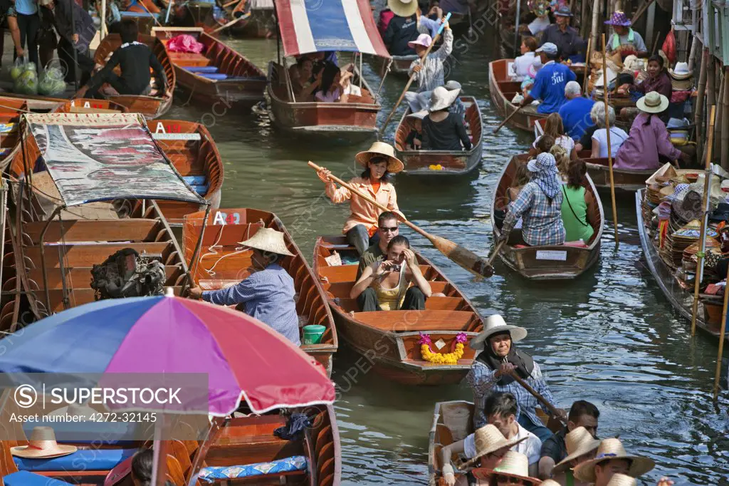 Thailand. A very busy canal, or khlong, at the bustling floating market at Damnern Saduak, 80 km southwest of Bangkok, which has been in existence since 1872.