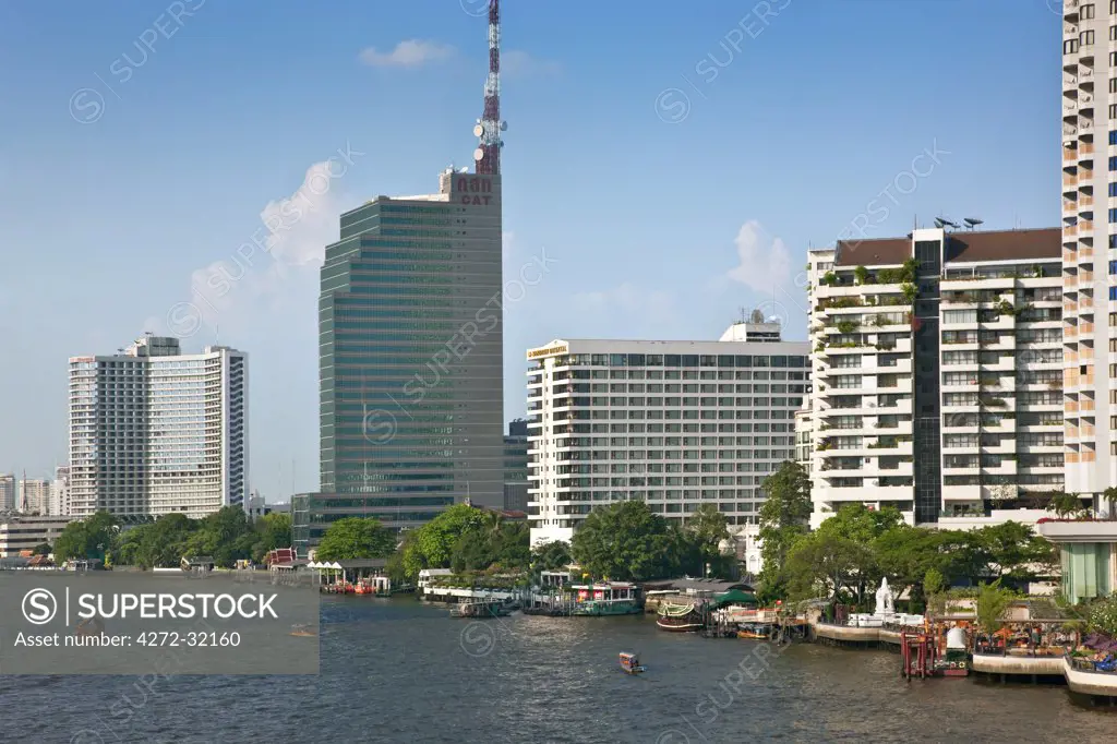 Thailand. A view of the impressive development along the Chao Phraya River where many five-star tourist hotel are situated in Bangkok City.