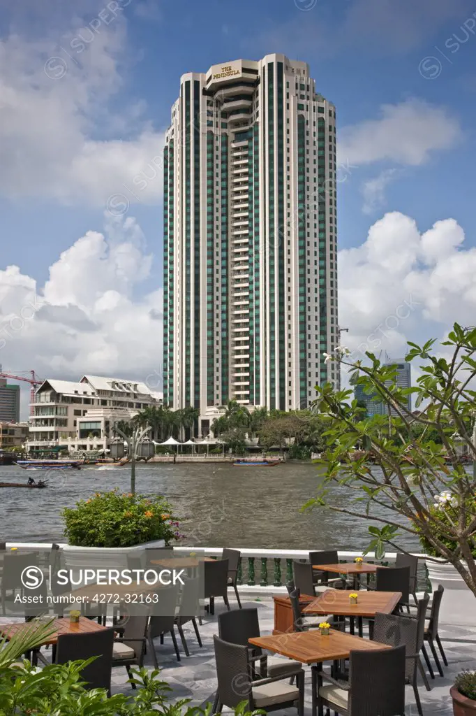 Thailand. The impressive Peninsula Hotel on the banks of the Chao Phraya River where many five-star tourist hotel are situated in Bangkok City.