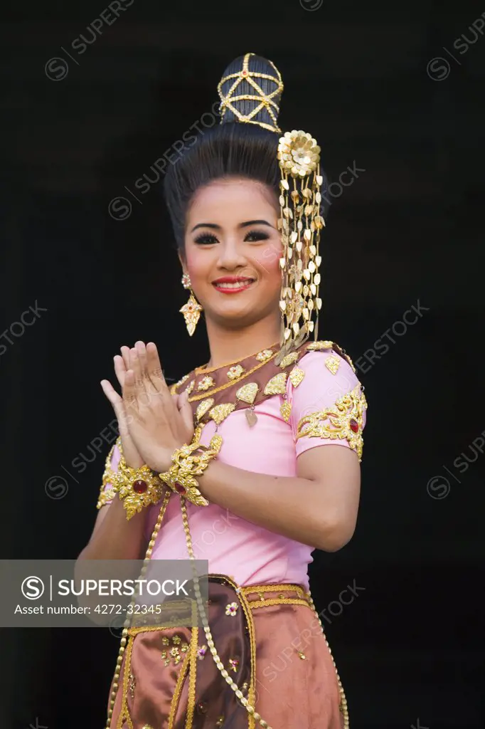 Thailand, Nakhon Ratchasima, Phimai.  Dancer at the Khmer temple of Prasat Phimai during the annual Phimai festival.  The festival in November celebrates the town's history and culture with dances, boat races and a sound and light show.
