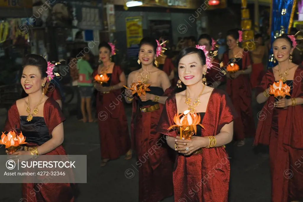 Thailand, Nakhon Ratchasima, Phimai.  Parade through the streets of Phimai during the annual Phimai festival.  The festival in November celebrates the town's culture and history with dances, boat races and a sound and light show.