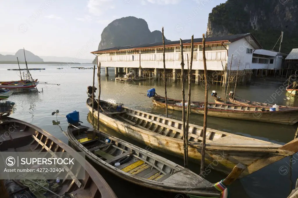 Thailand, Phang-Nga, Ko Panyi.  Long-tail fishing boats at the Muslim village of Ko Panyi.  The village's 2000 inhabitants are believed to be descended from seafaring families who arrived from Java over 200 years ago.