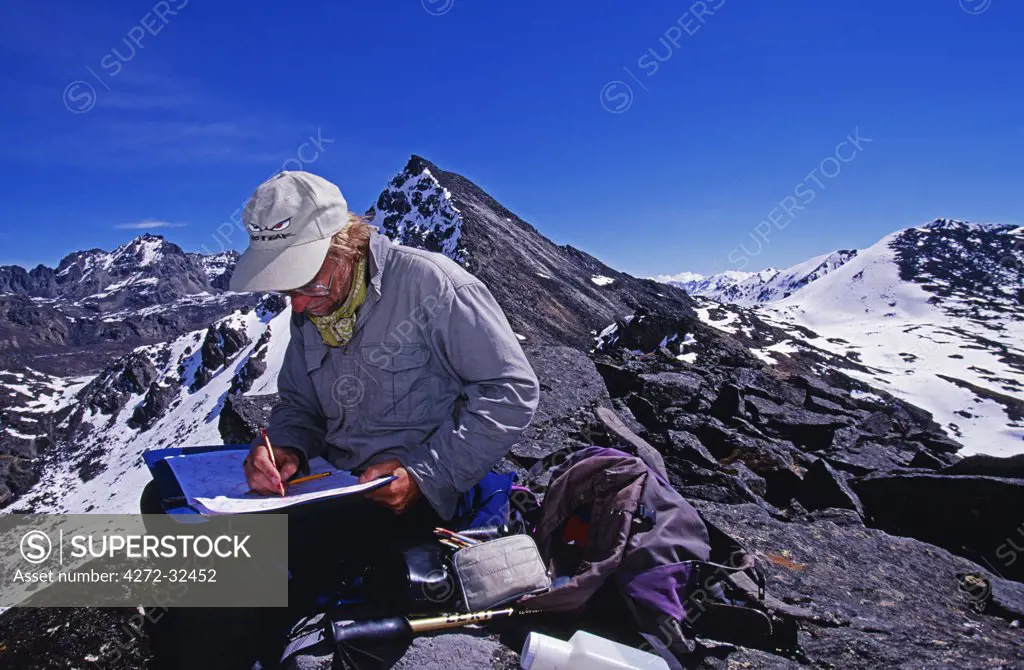 Tibet, Chomolungma, Kangshung Valley. Geological survey along a ridge near the Sho La Pass on the way into the Kangshung Valley on the East side of Mount Everest. The Kangshung Valley was used by mountaineering expeditions seeking to climb Mount Everest in 1920's because Nepal was closed to foreigners.