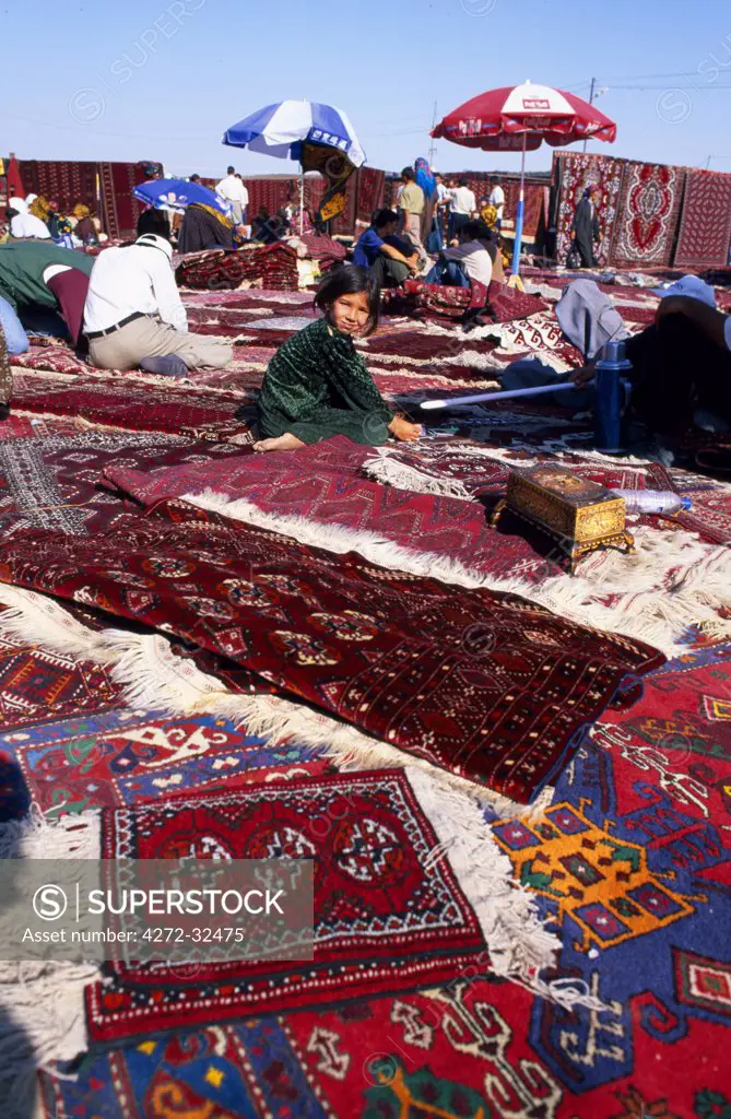 Carpets and rugs laid out for sale at  the Tolkuchka Bazaar.