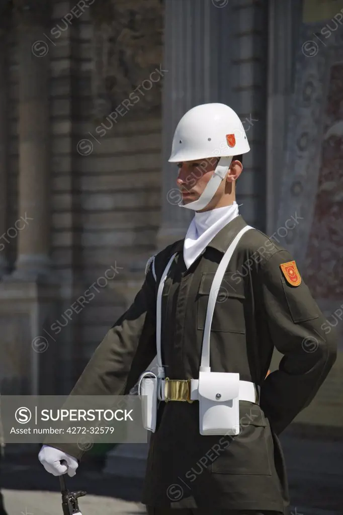 A ceremonial guard stands outside the Dolmabahce Palace in Istanbul, Turkey