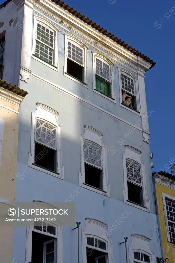 Brazil, Bahia, Salvador. Within the historic Old City, a UNESCO World Heritage site, near the Sao Francisco Church and Convent of Salvador, detail of the renovated classic windows, shutters and facade of colonial style town houses.