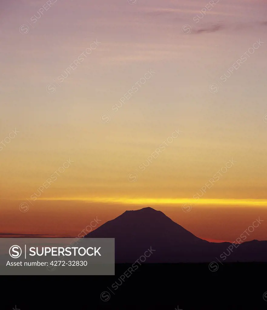 Sunrise over Ol Doinyo Lengai, The Maasais Mountain of God, which is the only active volcano in the Gregory Rif,an important section of the eastern branch of Africas Great Rift Valley.