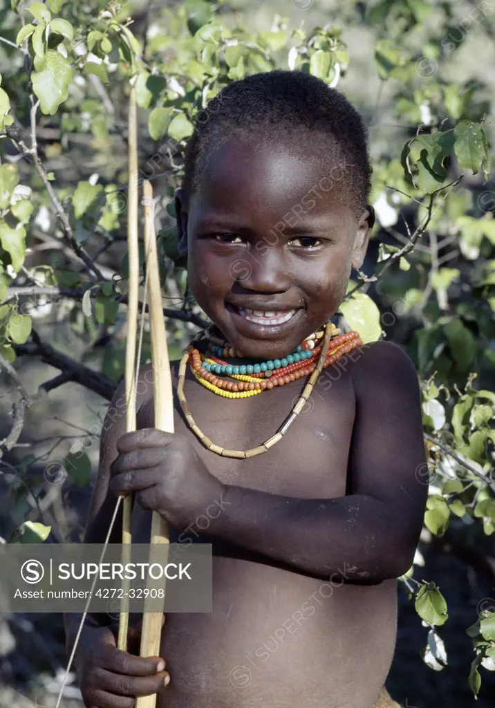 A Hadza boy carrying a bow and arrow.The Hadzabe are a thousand-strong community of hunter-gatherers who have lived in the Lake Eyasi basin for centuries.  They are one of only four or five societies in the world that still earn a living primarily from wild resources.