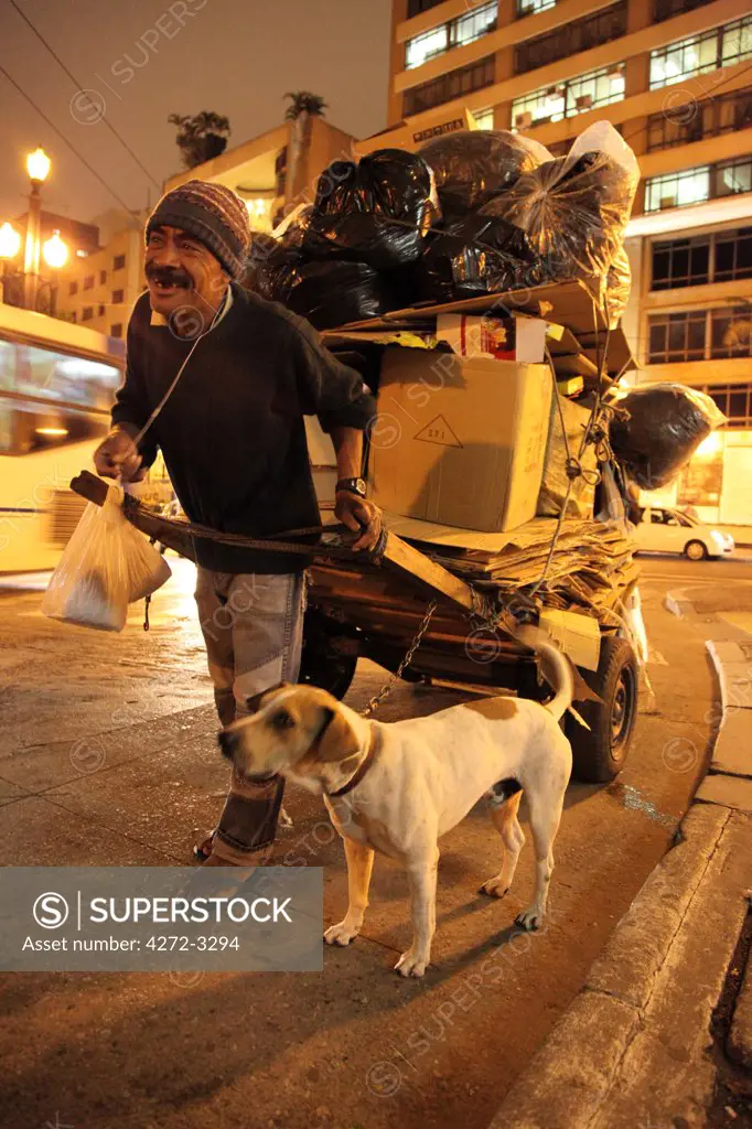 Homeless man with his dog in downtown Sao Paulo. Brazil