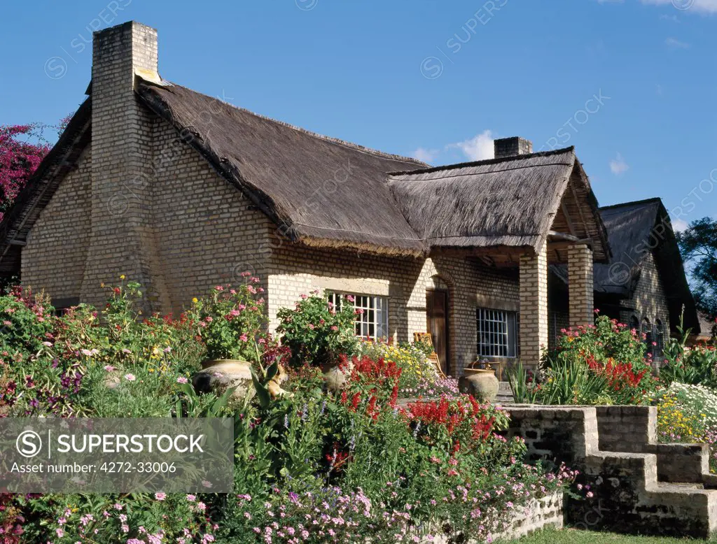 Gibbs Farm, a thatched farmhouse set in a beautiful garden on a farm in the Southern Highlands of Tanzania.