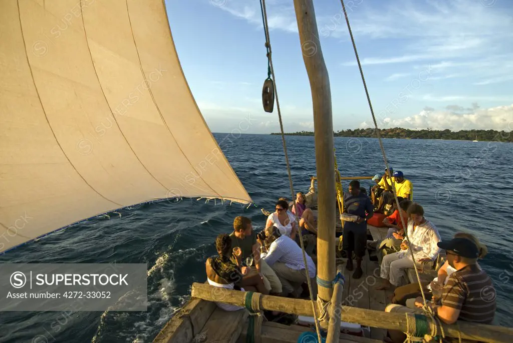 Sailing a traditional Dhow at sunset, Fundu Lagoon Resort, Pemba Island, Zanzibar, East Africa