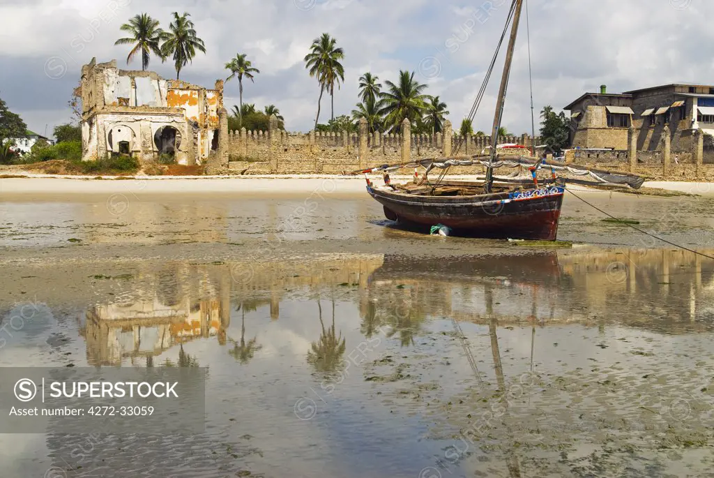 East Africa, Tanzania, Zanzibar. A boat moored on the sands of Bagamoyo.