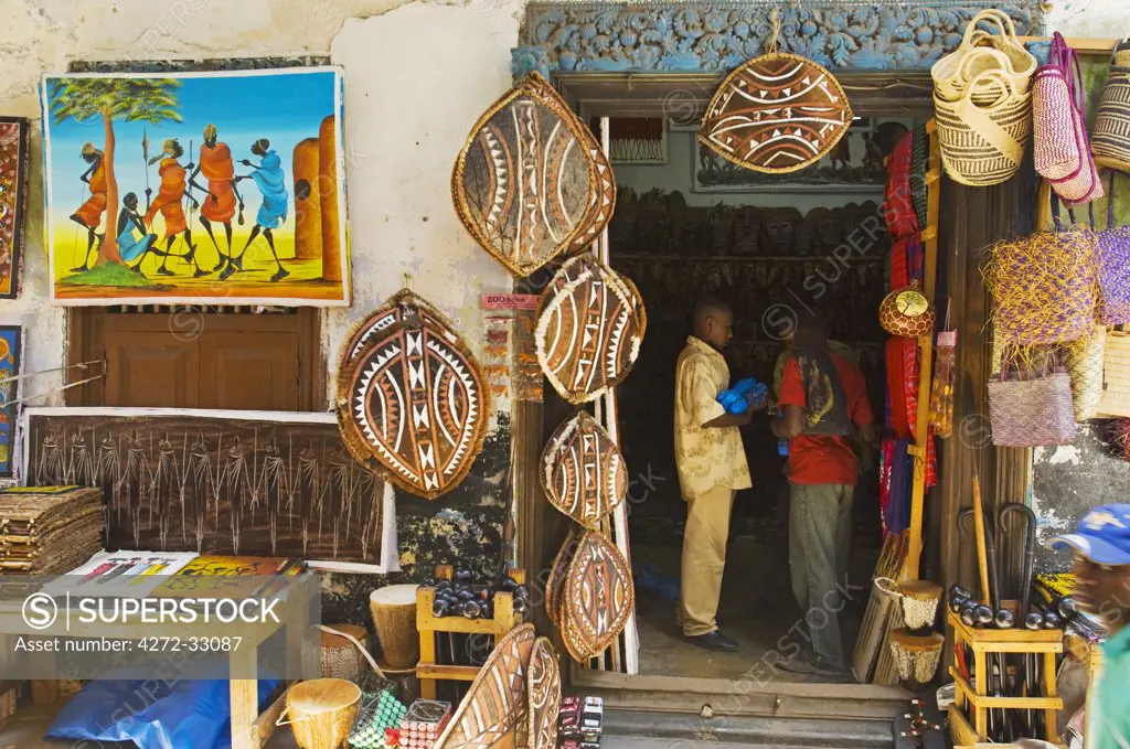 East Africa; Tanzania. Shop displaying tourist artefacts in the centre of Stonetown, Zanzibar Island.