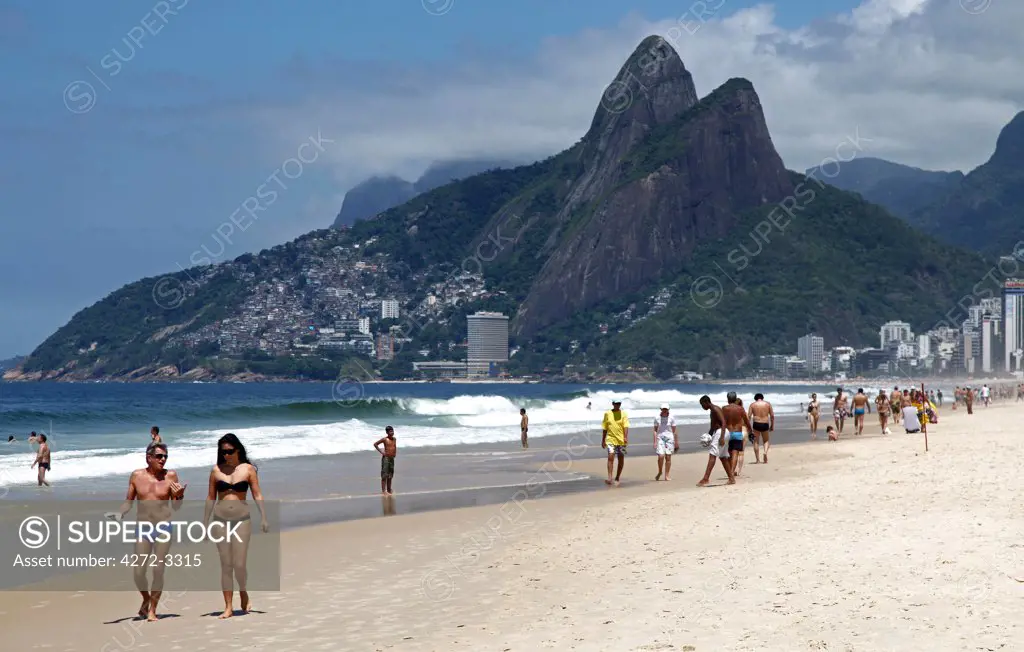 The famous Ipanema Beach in Rio de Janeiro with the Two Brothers Mountain in the background. Brazil